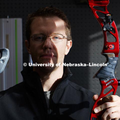 David Wolfe, a 2017 College of Business graduate, holds a 3D printed grip for his recurve bow. Wolfe is working with NIC's Maker Space to develop a custom bow grip to help him gain a spot on the Olympic Archery Team. Wolfe will train in California to try